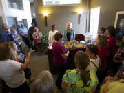 Behind the refreshment table, state Sen. Ann Rivers, R-La Center, left, and state Rep.