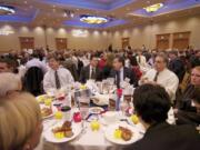 Participants talk and enjoy breakfast before the start of the 2013 Economic Forecast Breakfast this morning.