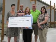 Washougal: West Columbia Gorge Humane Society Executive Director Tamara Scharfenkamp, from left, Drew Snyder, Lacamas Community Credit Union President Kathleen Romane, Mark Fruechtel and fundraising chair Darci Lee.