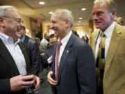 Clark County Commissioner Tom Mielke, from left, celebrates Tuesday at the Heathman Lodge with commissioner candidate David Madore, both of whom are leading their races, and Republican Paul Harris, who won another term as a state representative from the 17th District.