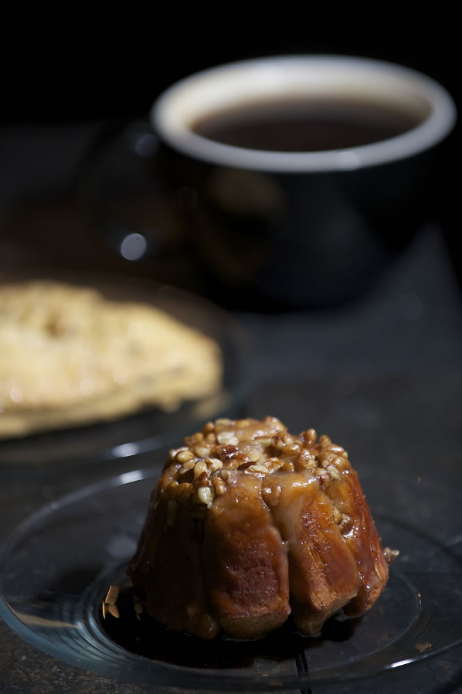 An Americano coffee, sticky bun and scone at Brewed Awakenings.