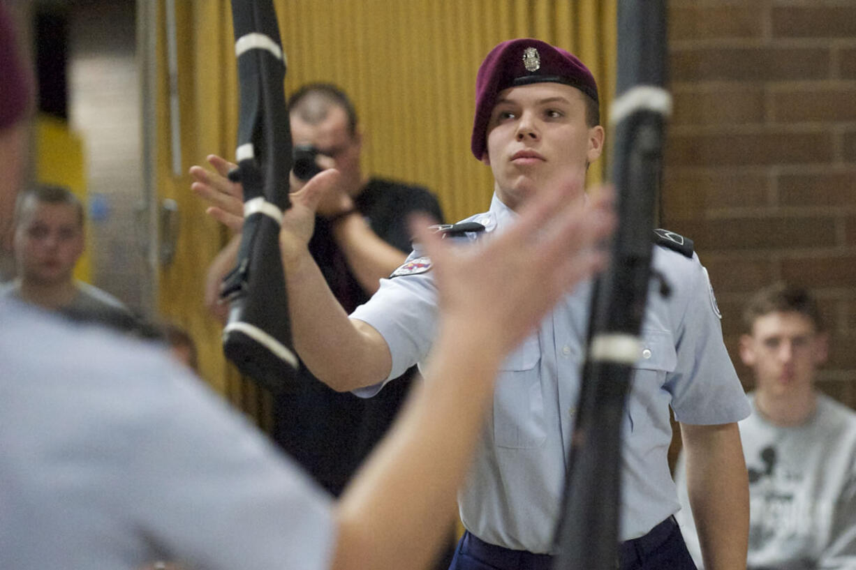 Alfson, right, and Watson complete a rifle exchange move in the duals competition.