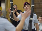 Alfson, right, and Watson complete a rifle exchange move in the duals competition.