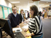 Clark College student Tyauna Houston talks with librarian Zachary Grant as she pursues a degree in social work.