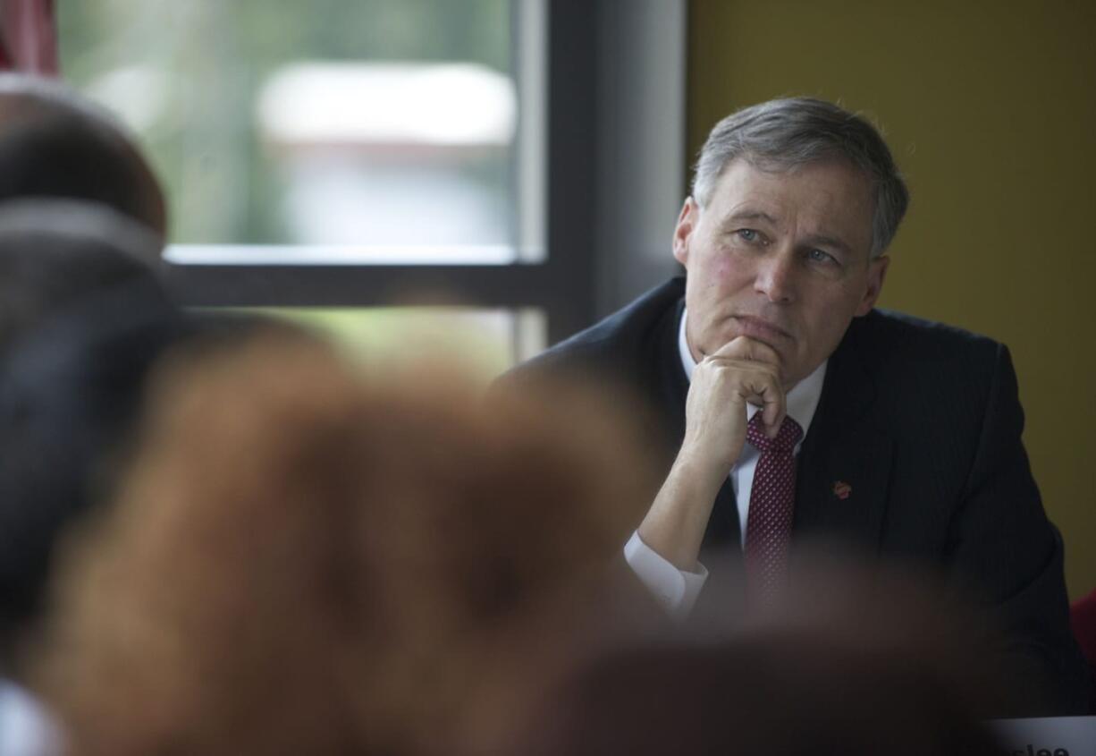 Democratic Gov. Jay Inslee meets with more than two dozen business and local government leaders at the Vancouver Community Library on March 22. He stressed the importance of building the Columbia River Crossing, as well as the divisiveness of the megaproject.