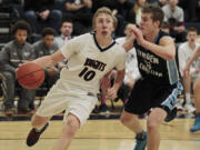 King&#039;s Way Christian guard Skyler Freeman (10) drives against Lynden Christian&#039;s Nate Hielkema (right) during the Knights&#039; 60-51 loss Tuesday.