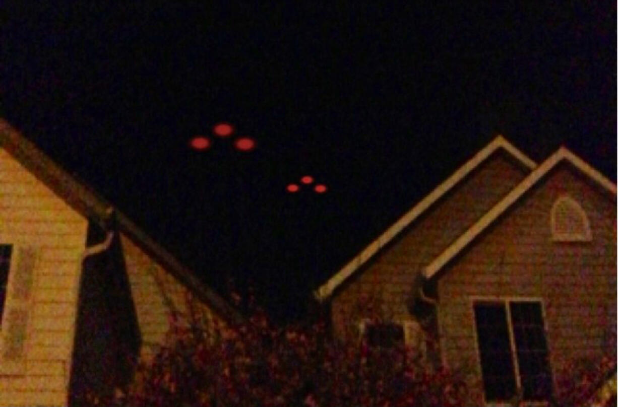 The husband of Battle Ground resident Nicole Keller captured this image of strange lights in the sky with his cellphone Monday. He didn't want his name used in the paper, she said.