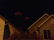 The husband of Battle Ground resident Nicole Keller captured this image of strange lights in the sky with his cellphone Monday. He didn't want his name used in the paper, she said.