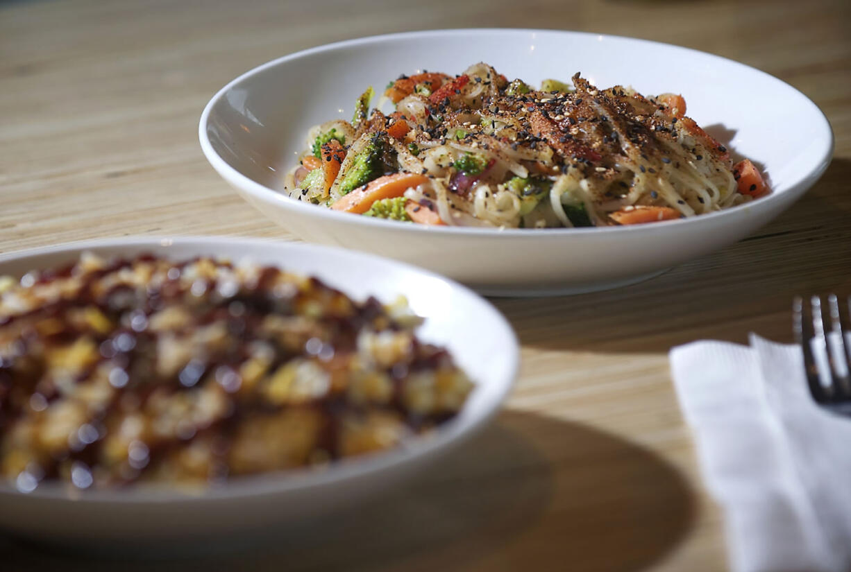 The Barbecue Pork Mac &amp; Cheese, foreground, and Bangkok Curry at Noodles &amp; Company.