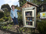 Carla Schreiber and her husband Bob Whitt installed a &quot;Little Free Library&quot; outside their east Vancouver home earlier this year.