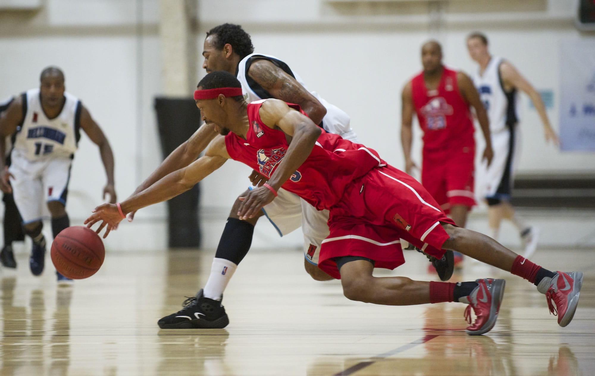 Vancouver Volcanoes Kevin Bloodsaw dives for a loose ball against the Bellingham Slam during the IBL championship game Friday.