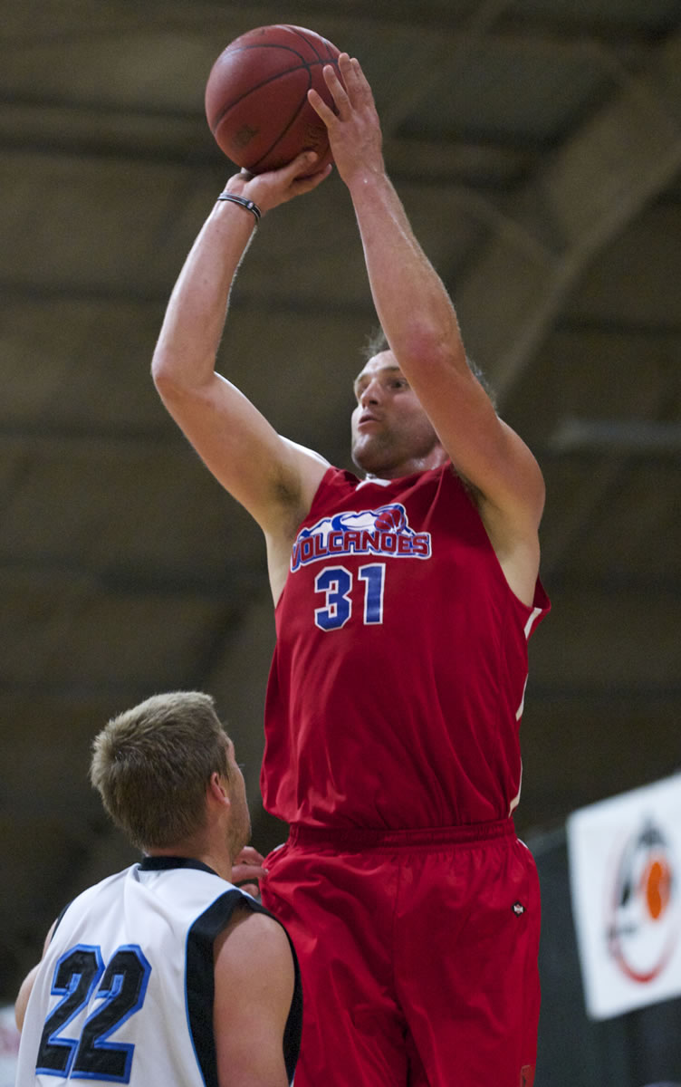 Vancouver Volcanoes Paul Hafford (31) shoots a 3-pointer over Bellingham Slam's Jacob Stevenson (22) during the IBL championship game Friday.