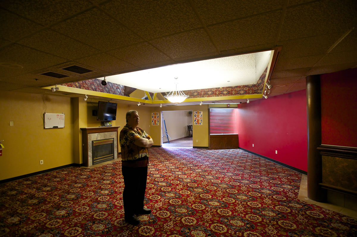 Larry Bowman, general manager of Woodland's Oak Tree Restaurant, stands in what he hopes will be a billiard room at the renovated restaurant and cardroom.