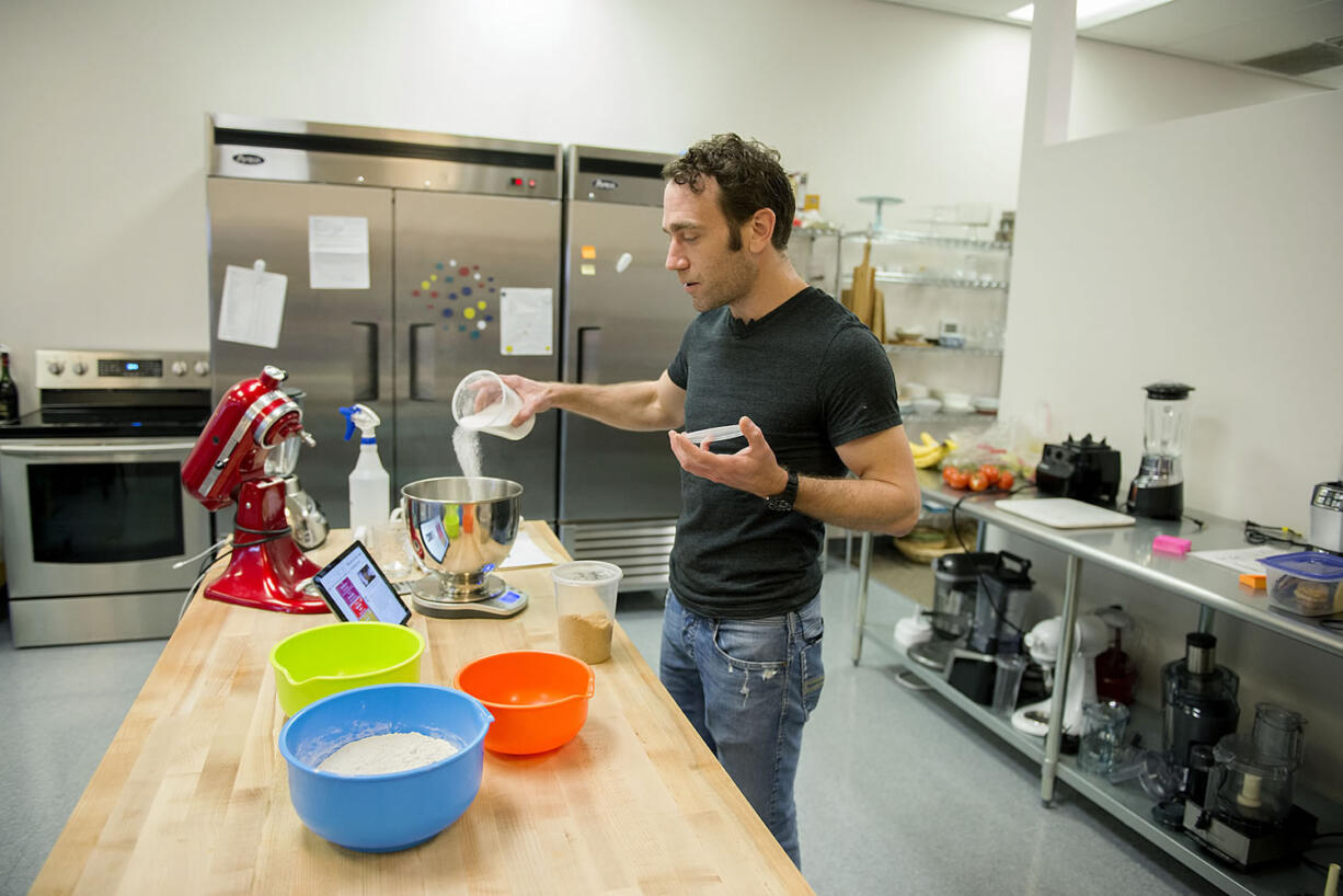 Matthew Barbee, head of recipe development for Perfect Co., makes chocolate chip cookies using Perfect Bake at the company&#039;s downtown Vancouver test kitchen.