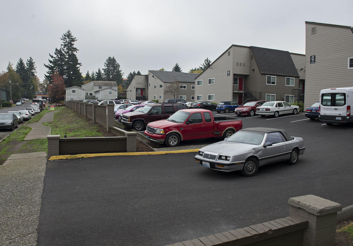 A motorist exits the parking lot Wednesday morning at Parc Central apartments in Vancouver.