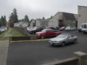 A motorist exits the parking lot Wednesday morning at Parc Central apartments in Vancouver.