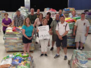 Living Hope Church
Living Hope Church staff and volunteers pose with nearly 19,600 pounds of donated pet food earlier this month. They believe the total is enough to break the current Guinness World Record for &quot;largest donation of pet food in one week&quot; and are awaiting official word from the company, famous for tracking such achievements.