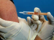 A flu vaccine is administered.