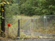 The gated driveway where Michael Livingston was found Friday morning.