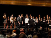 Central Park -- The Woodland High School Concert Choir performs under the direction by Brent LiaBraaten, center, at Clark College's Fall Choral Festival on Nov.