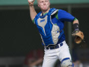 National League catcher Greg Ryan of Mountain View throws to first base for the final out of the sixth inning during the first of Wednesday's two games at Propstra Stadium.