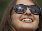 Olivia Orozco of Brooklyn, N.Y., models her sunglasses while in Esther Short Park in Vancouver on Wednesday.