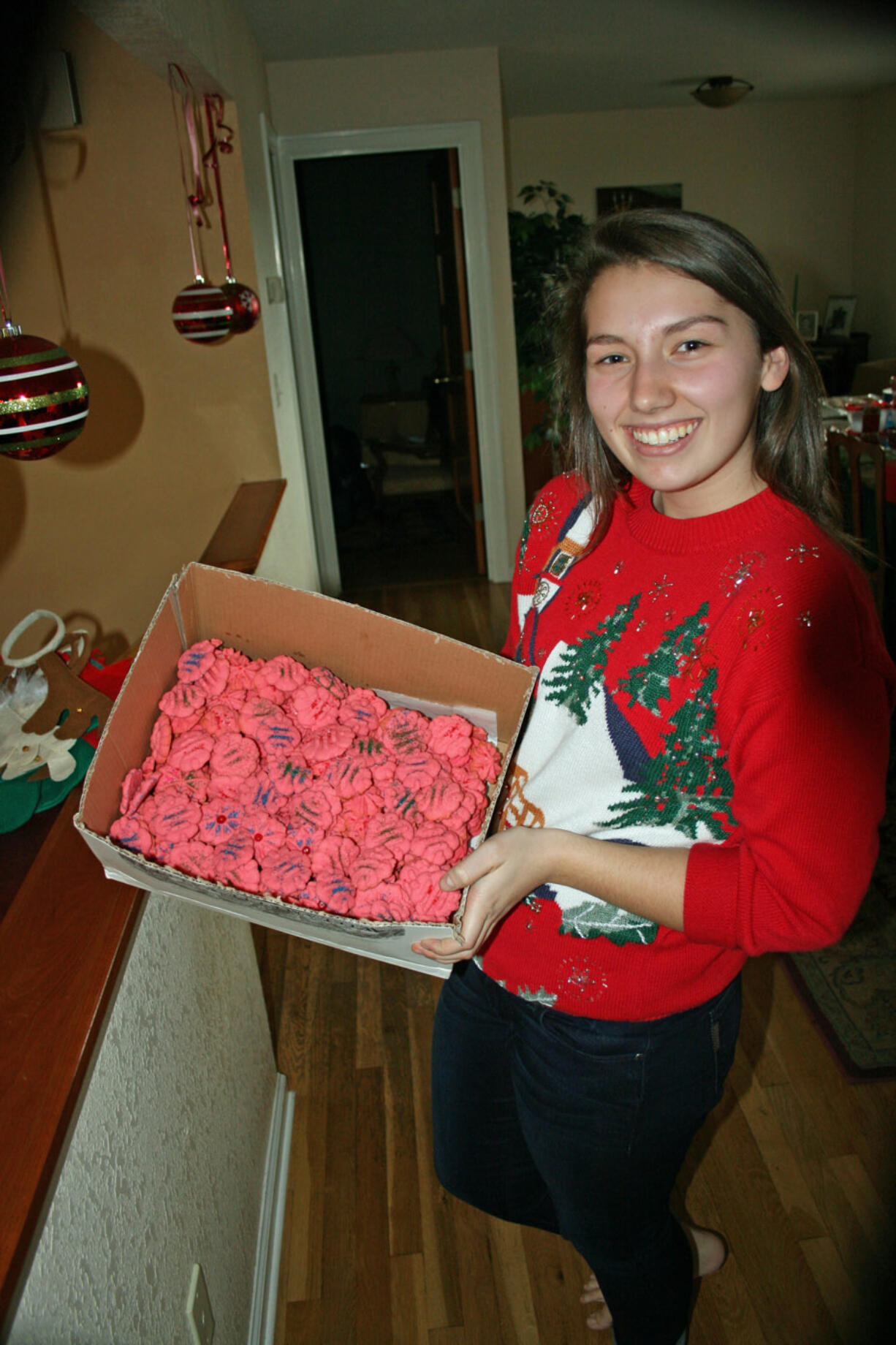 Central Park: Hunter Simpson shows a few of the 140 dozen cookies baked by Red Cross Youth members.