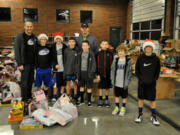 Camas: The boys of D1 Basketball Dreams donated toys to the fire station for distribution to the needy.