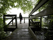 Laina Harris pauses during a walk on Heritage Trail to look out over Lacamas Lake in Camas on Wednesday.