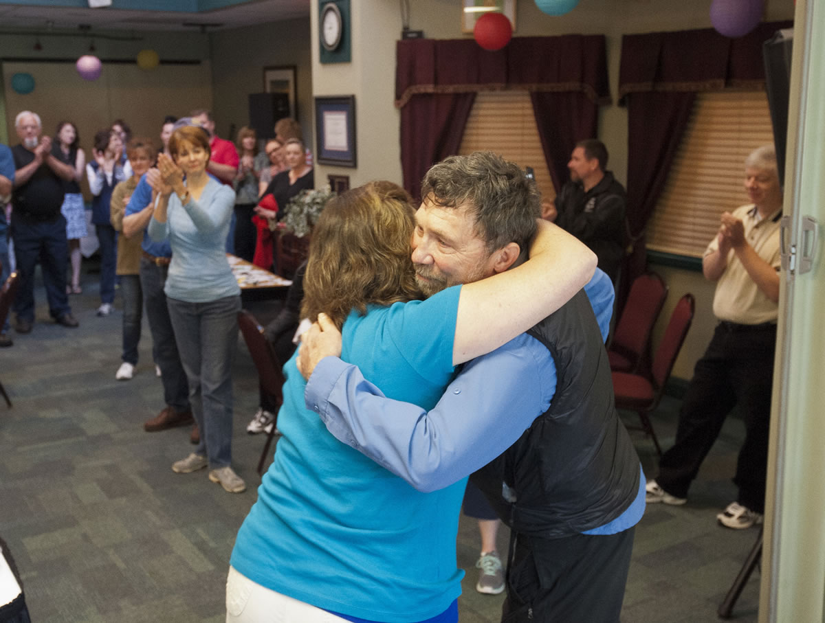 Clark County Skills Center staff members throw Paul Haack, center, a retirement breakfast at the school Thursday morning.