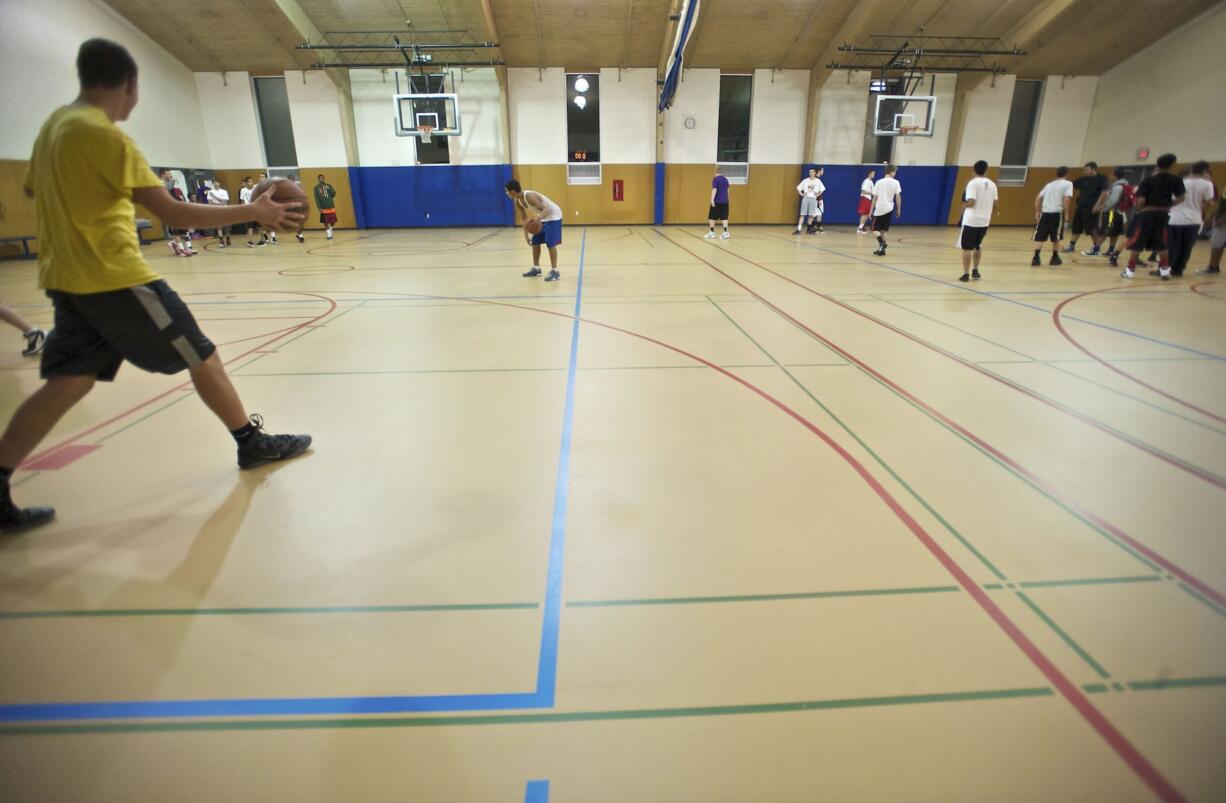 Students enjoy Teen Late Nights at Marshall Community Center on Nov. 9. The program, which runs 8 to 11 p.m. on Fridays during the school year, was canceled in February because of city budget cuts but was restored thanks to a grant from the Community Foundation of Southwest Washington.