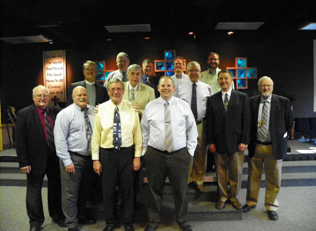 Orchards: After recently completing vicar training, Eli Thomas, front row right, became pastor of Vancouver's Christ Community Lutheran church on Oct.