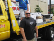 Esther Short: Cruisin' the Gut organizer Phil Medina and son Aiden took 3,345 pounds of donated food to Share.