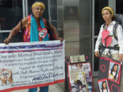 Esther Short: Cindi Fisher, left, and Aleshanee Akin brought a serious message about mental health care to the Clark County Courthouse on July 24.