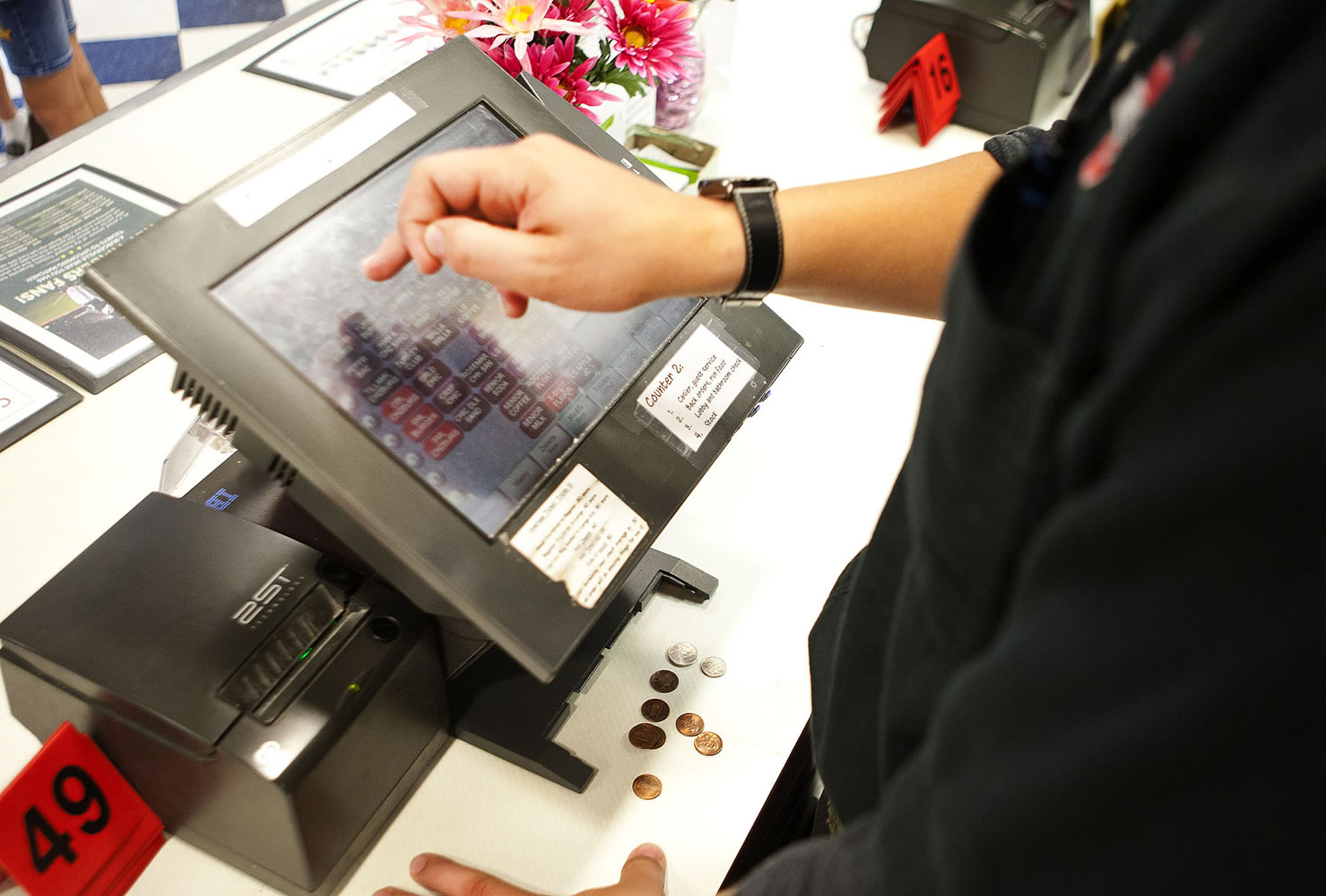 Lucas Schwartz, 17, rings in an order while working his shift at Burgerville.