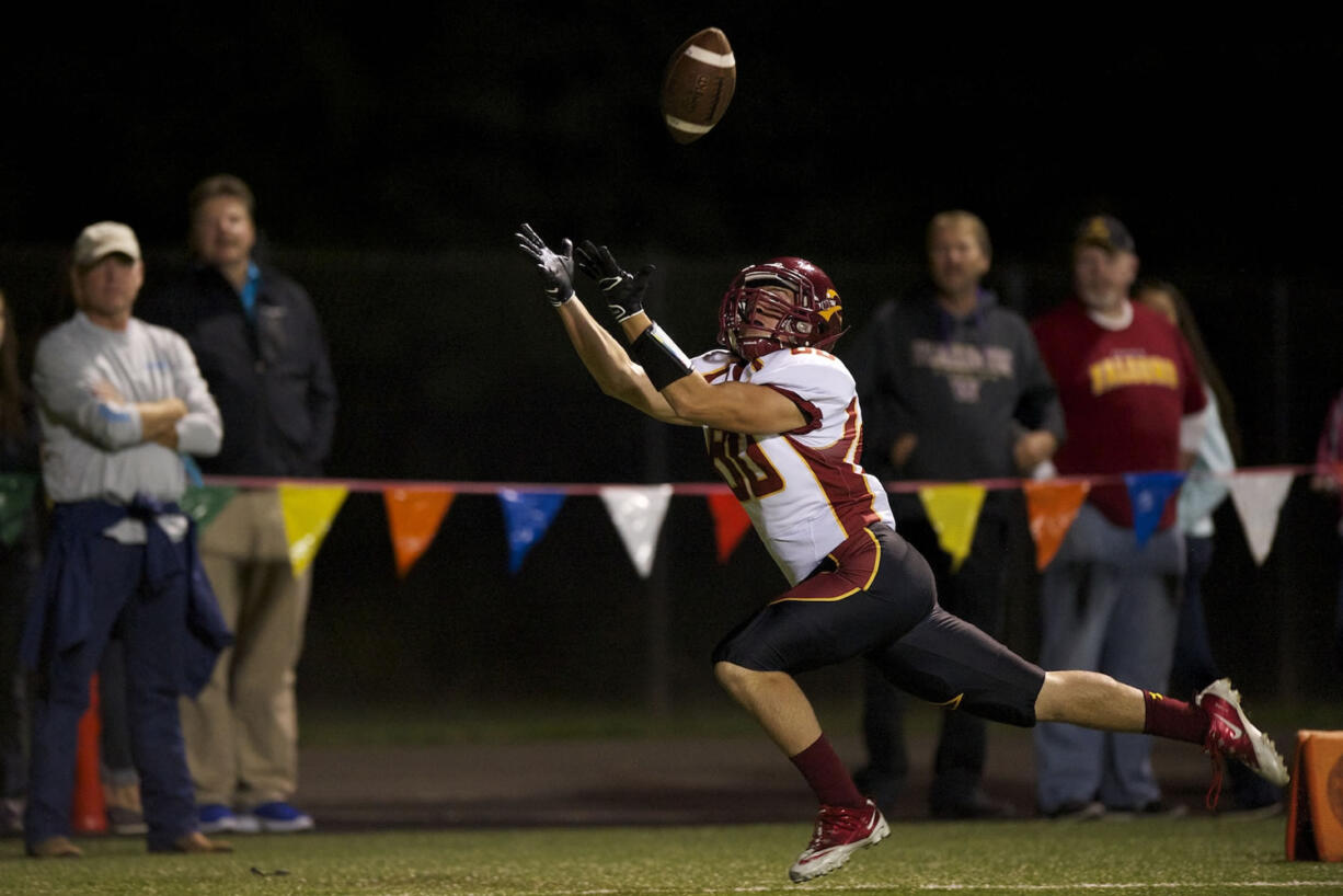 Taylor Martin of Prairie High School catches a touchdown pass against Skyview High School at Kiggins Bowl on Friday in Vancouver.