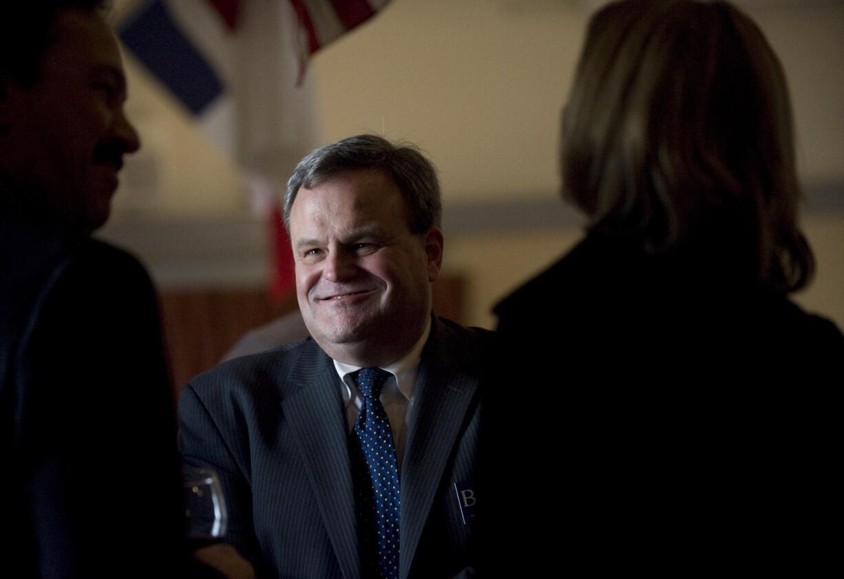 Brent Boger, then a candidate for county prosecuting attorney, works the room April 22, 2010, at a reception for him hosted by Republican former U.S. Sen.