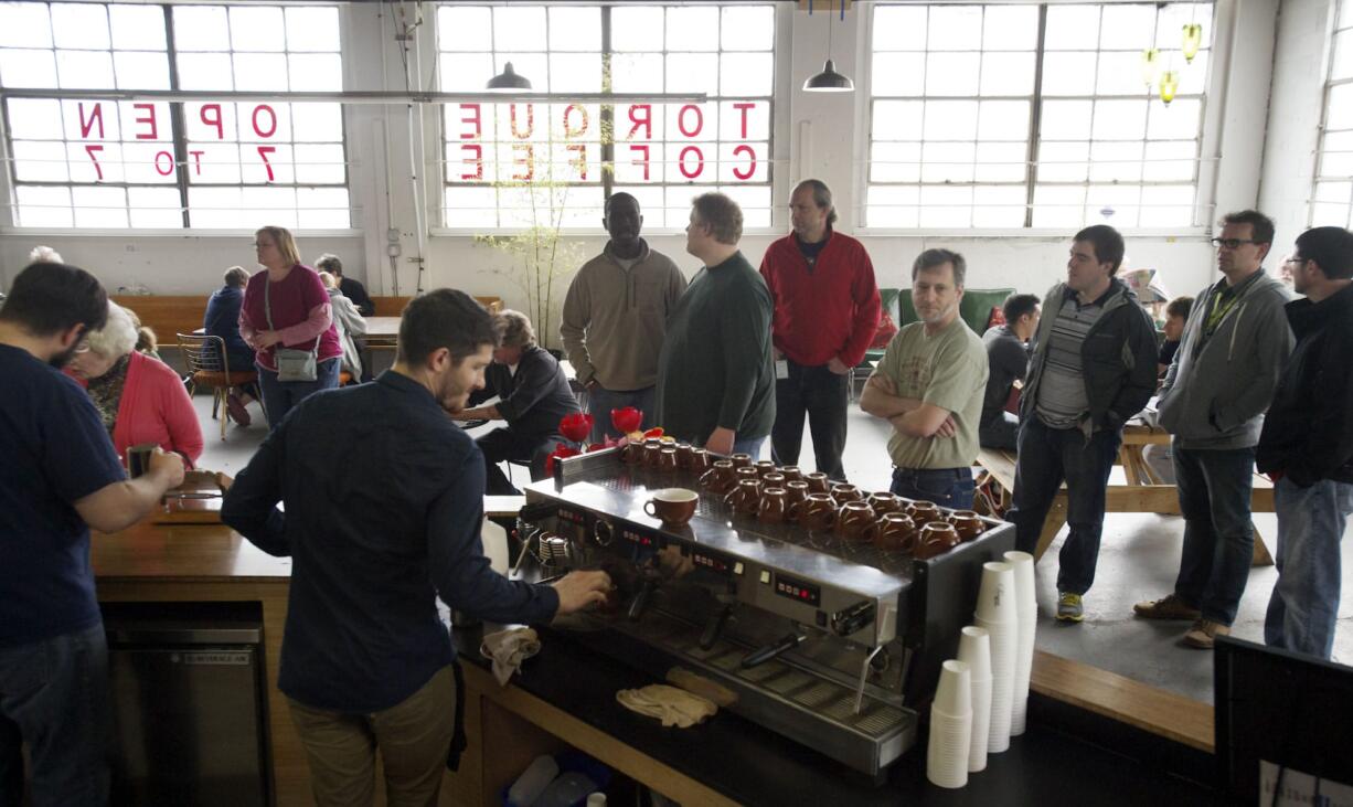 Torque Coffee was the subject of a community &quot;cash mob&quot; to raise money for the business and Kayli Becker, who was the barista working when a masked gunman robbed the coffee shop on Easter morning.