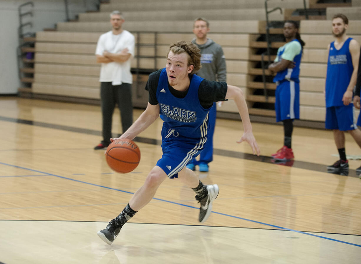 Clark College's Micah Paulson drives to the hoop during practice Nov. 23, 2015 at O'Connell Sports Center.