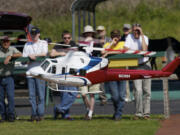 Jack Martin demonstrates his scratch-built Bell 412 helicopter for Clark County Skills Center students.