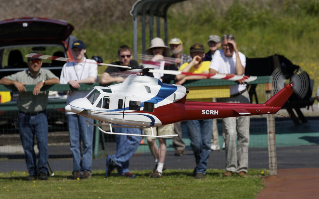 Jack Martin demonstrates his scratch-built Bell 412 helicopter for Clark County Skills Center students.