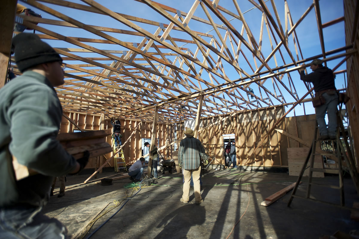 A whole community of friends and family members -- many of whom just happen to be skilled builders -- turned out Saturday morning to replace John Matson's Hockinson workshop, which burned down last month.