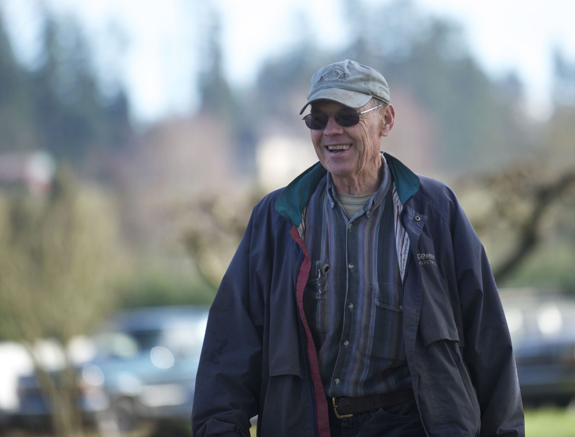 Roy Matson, brother of John Matson, joins volunteers as they help rebuild his brother's barn.