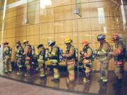 Firefighters wait to start the 22nd annual Scott Firefighter Stair Climb to benefit the Washington/Alaska Chapter of the Leukemia &amp; Lymphoma Society.