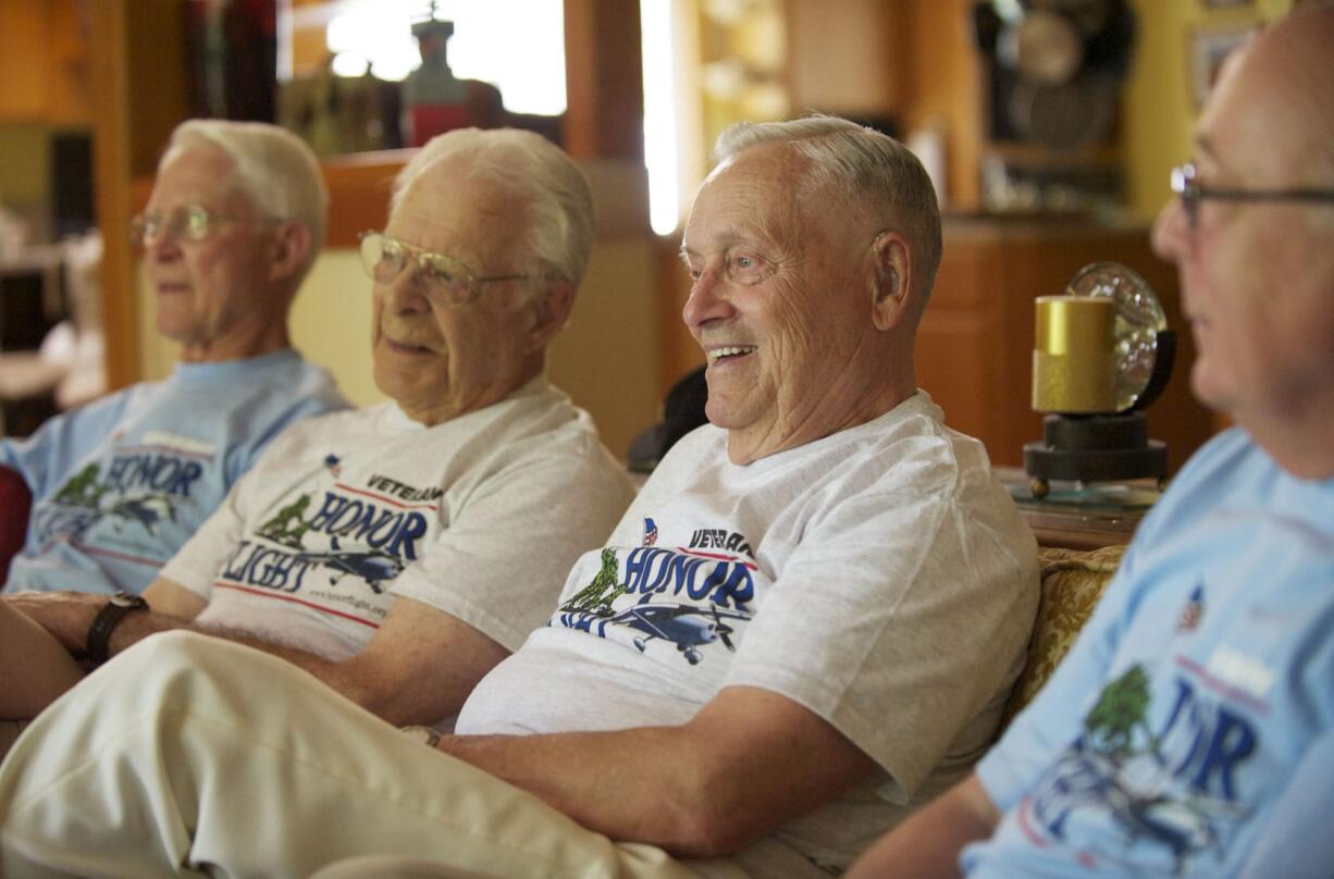 From left, Jim Mewhirter, World War II veterans Gil Stahl and Harry Van Sandt, and John Berg recently took part in an Honor Flight visit to the National World War II Memorial in Washington, D.C.