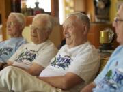 From left, Jim Mewhirter, World War II veterans Gil Stahl and Harry Van Sandt, and John Berg recently took part in an Honor Flight visit to the National World War II Memorial in Washington, D.C.