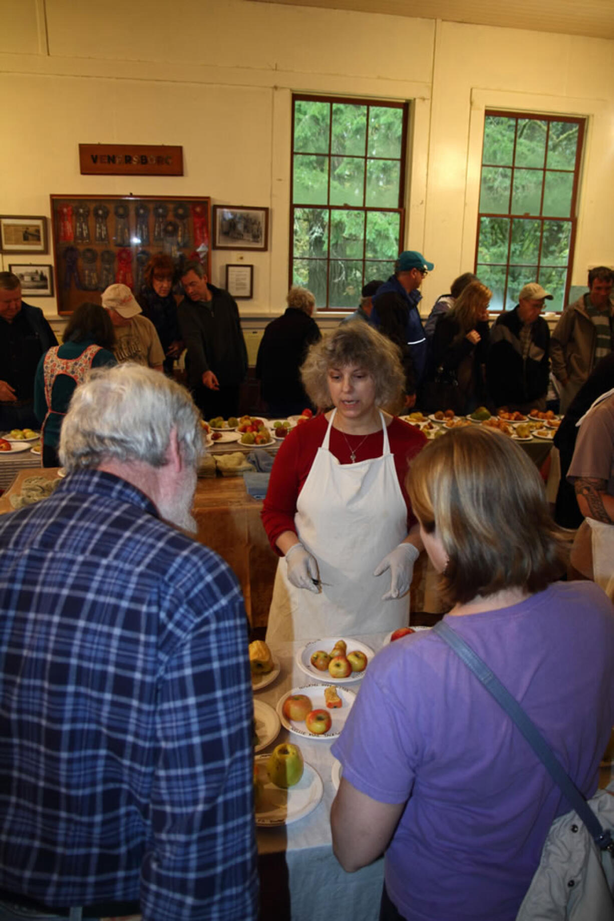 Venersborg: Sara Cooper serves up apple slices at the Sixth Annual Heirloom Apple Fest.