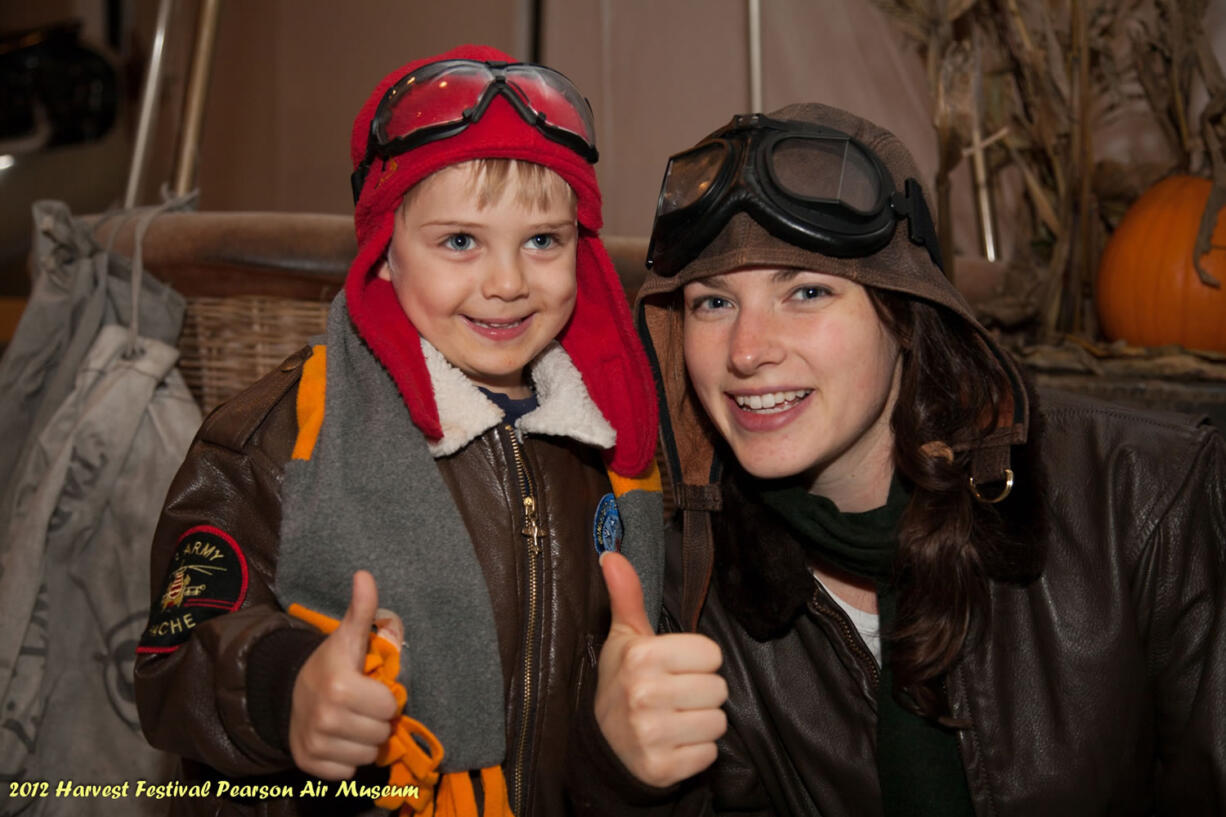 Pearson Field: The second annual Aviation Harvest Festival at Pearson Air Museum got a thumbs-up from visitor Duncan Vondross and museum volunteer Nicole Knotts.