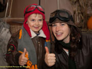 Pearson Field: The second annual Aviation Harvest Festival at Pearson Air Museum got a thumbs-up from visitor Duncan Vondross and museum volunteer Nicole Knotts.