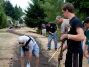 Volunteers from the First Place neighborhood and seven students from Evergreen High School recently built a new 900-foot soft path for First Place Park.